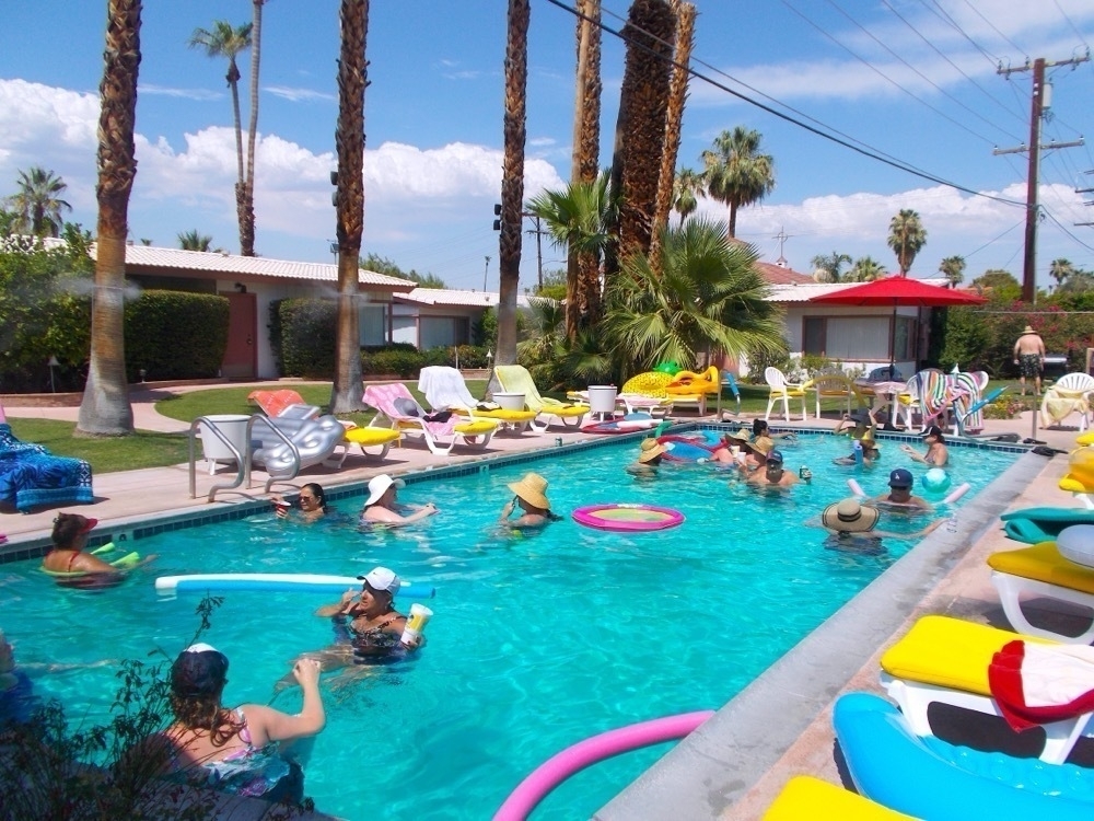 a pool full of people drifting around.