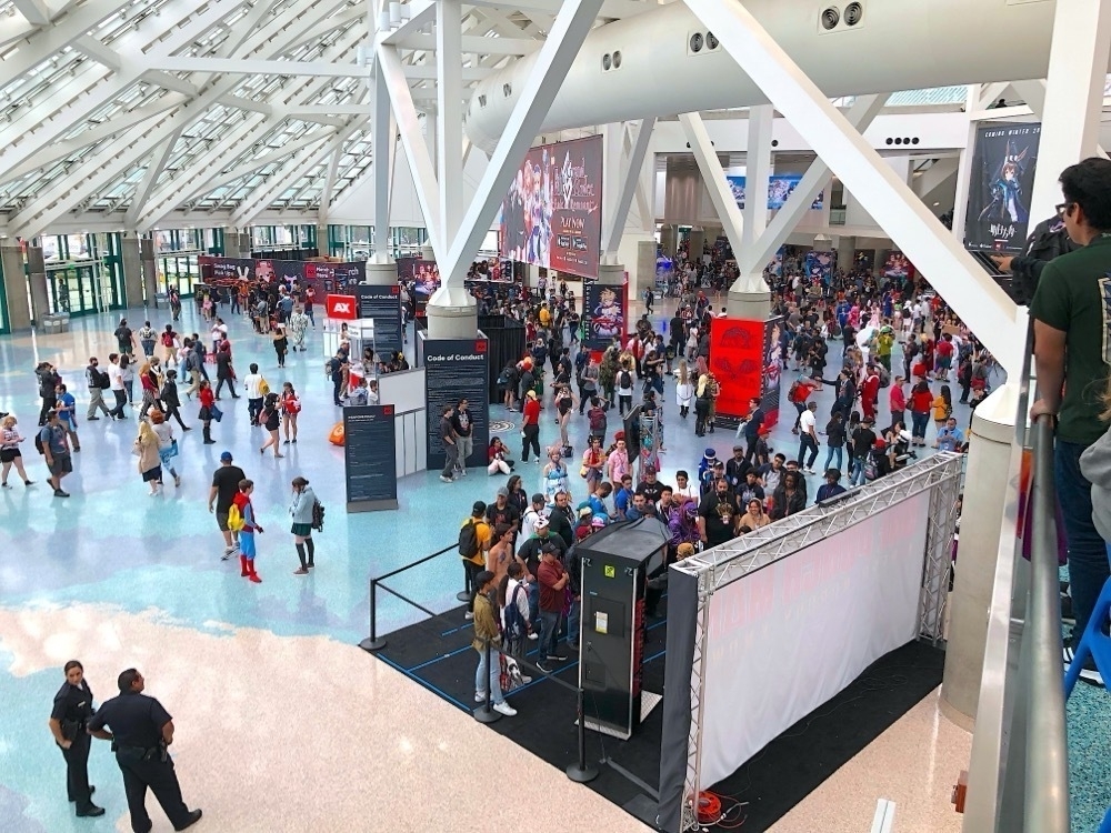 A crowd of people watching each other.