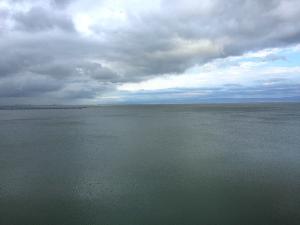 Storm clouds over a body of water.