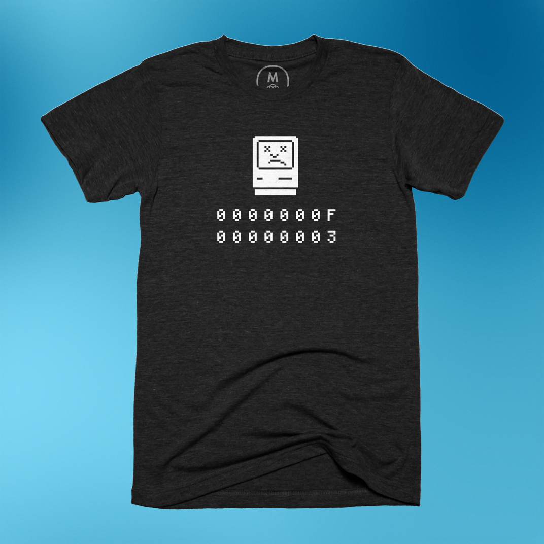 A nostalgic t-shirt featuring the Sad Mac error for fans of vintage Macintosh computers is available for purchase from Cotton Bureau.