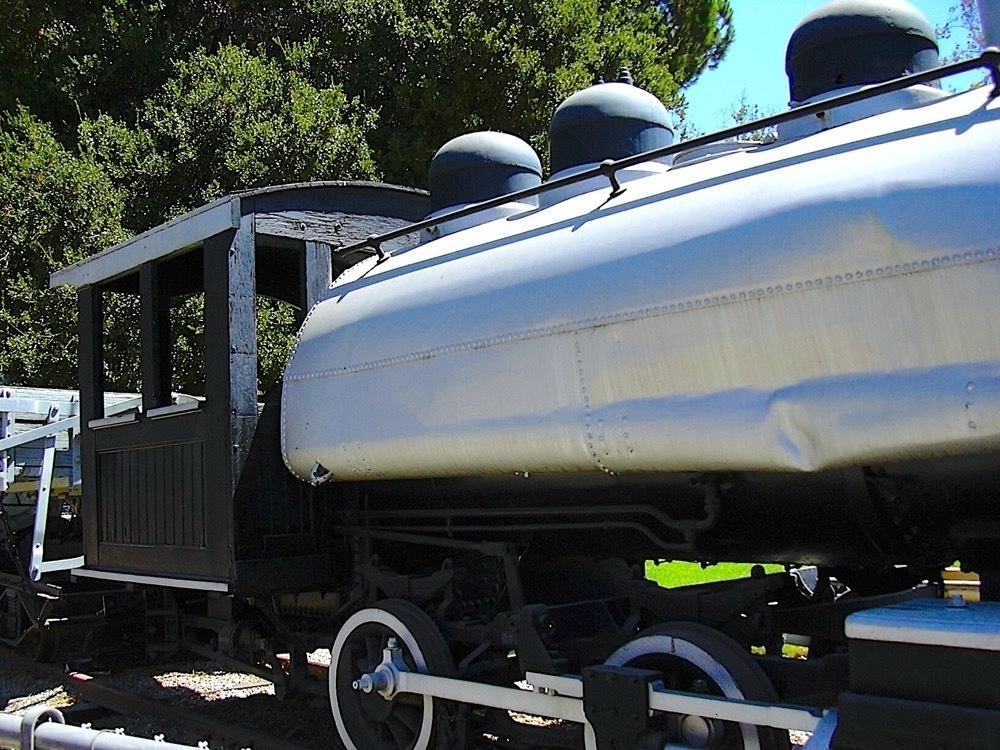 The side of an old steam locomotive.